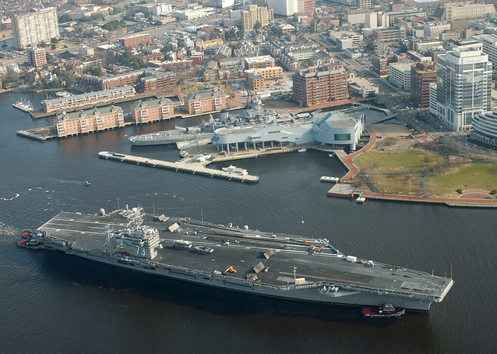 USS George Washington aircraft carrier passes USS Wisconsin in downtown Norfolk on the Elizabeth River